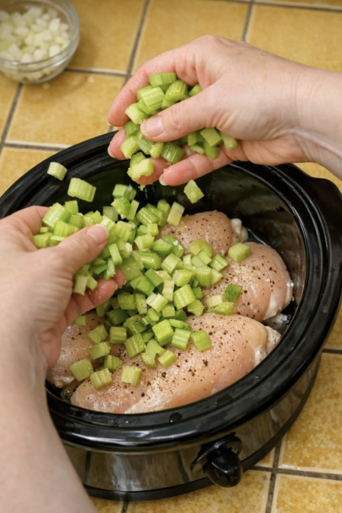 Toss chopped celery stalks over raw chicken breasts, together with 3 ingredients, into slow cooker for a comforting meal that’s always a yes in my house